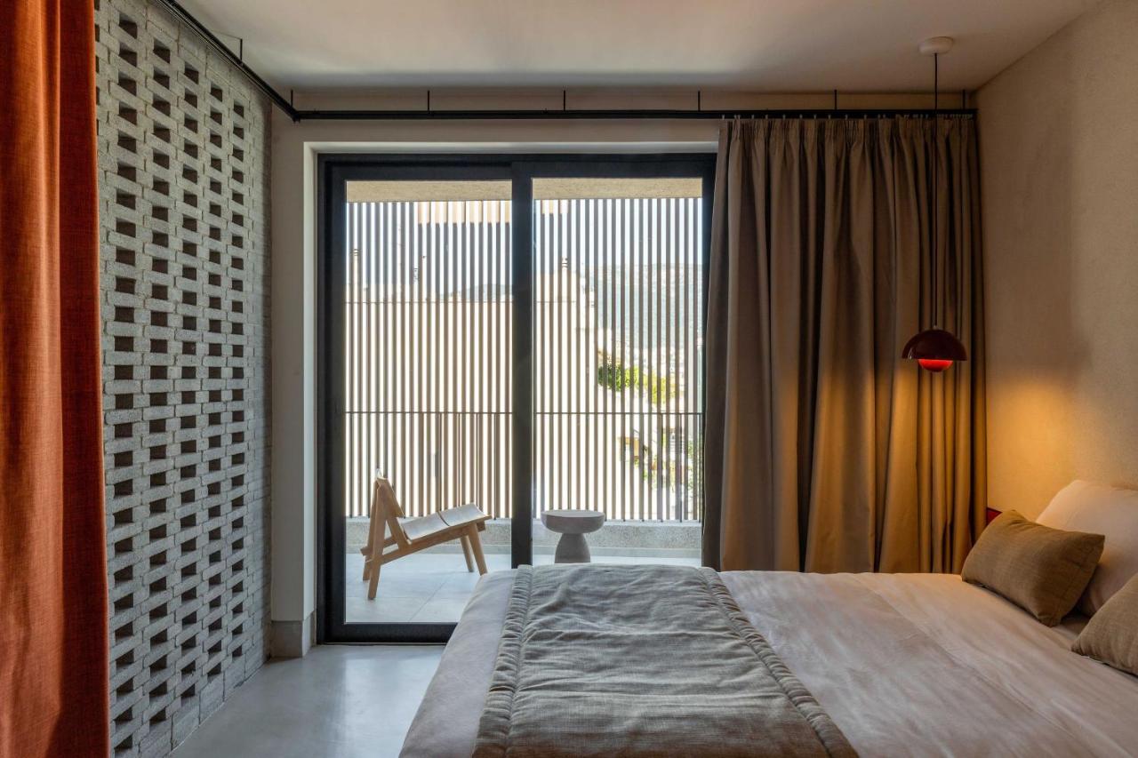 Hotel The Newel Psychiko Atenas Exterior foto A bedroom at the hotel